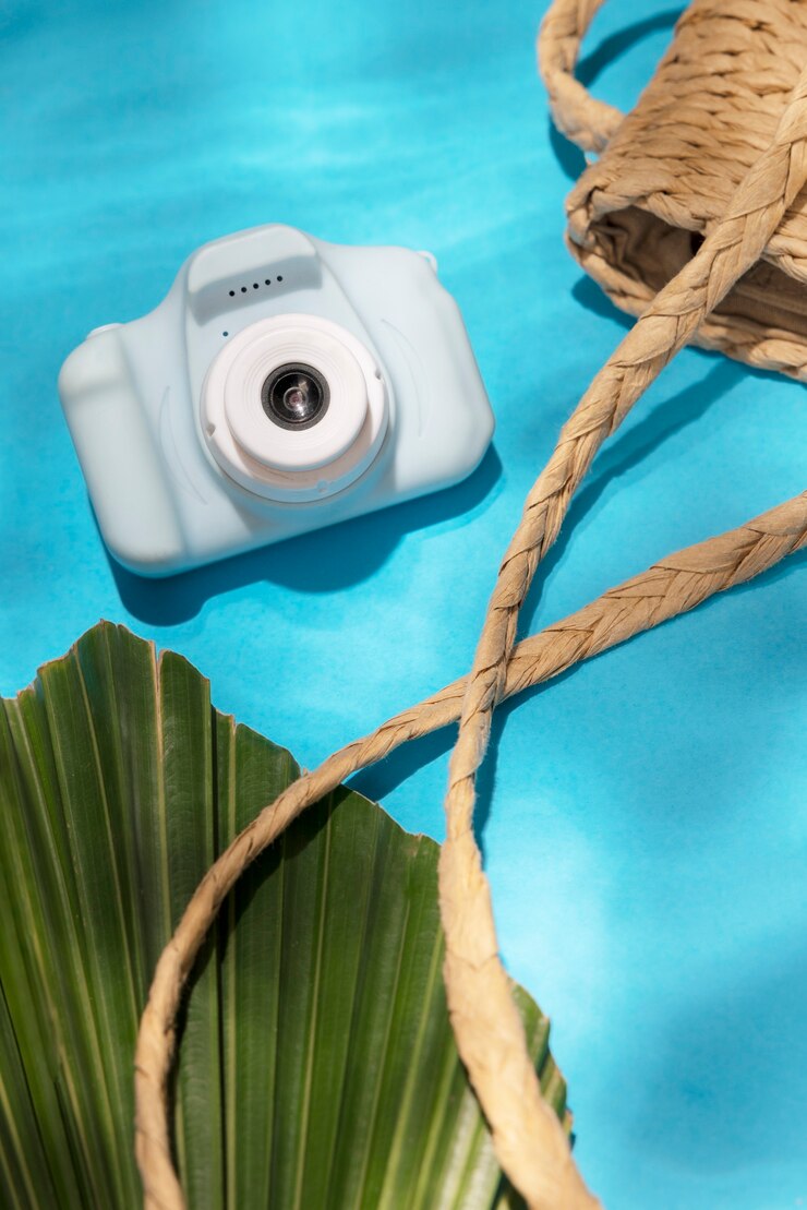 Alt text: A close-up of a Fujifilm Instax camera capturing a vibrant photo with colorful instant film emerging from the top
